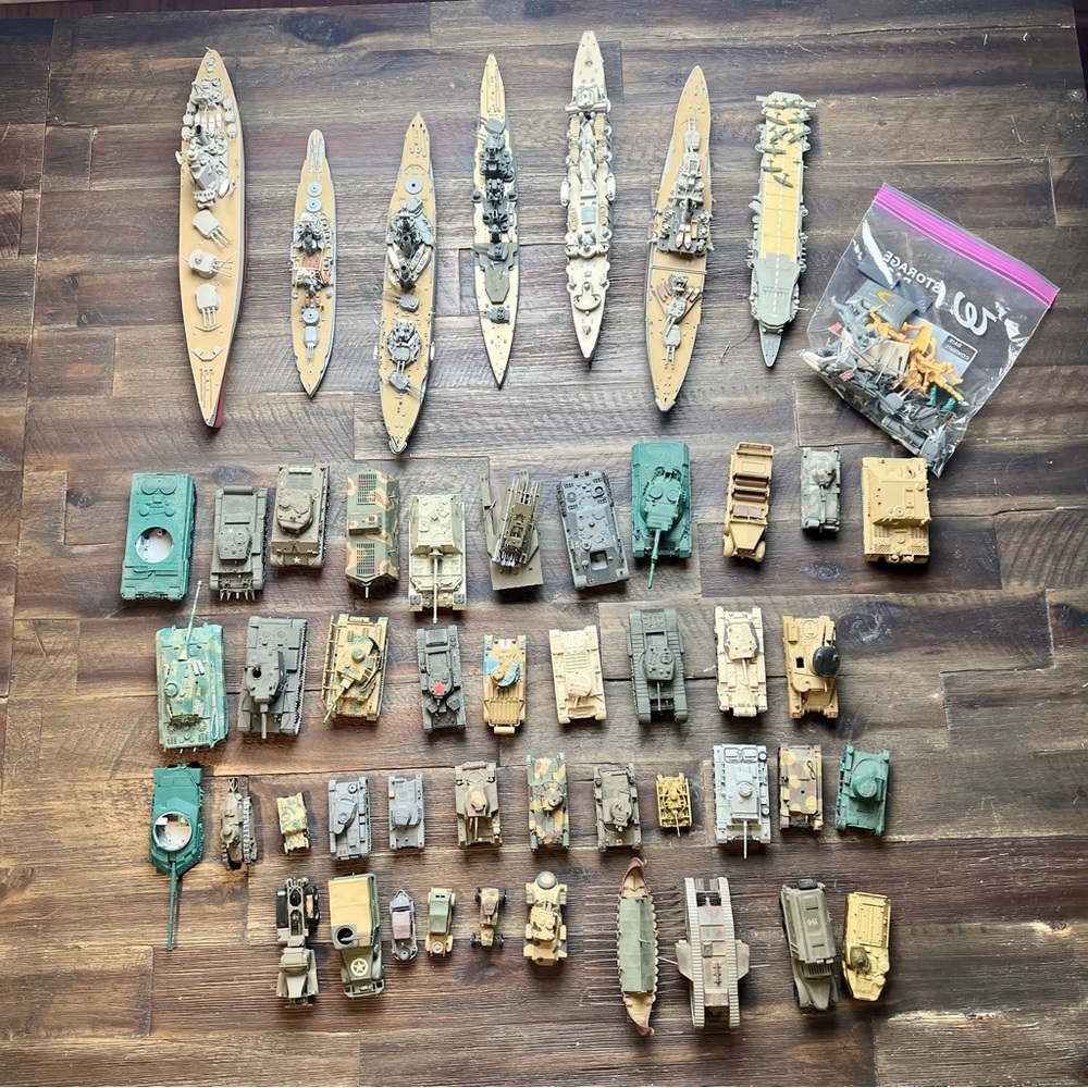 Collection of 49 miniature World War II military vehicles and ships